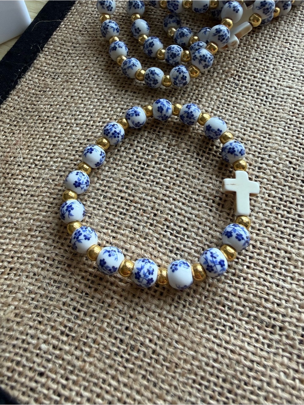 Blue Floral Porcelain Bead Bracelet with Gold Accents and White Cross